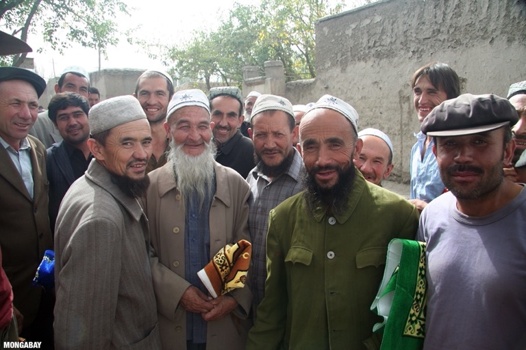 Muslim men with prayer mats in Kusrap